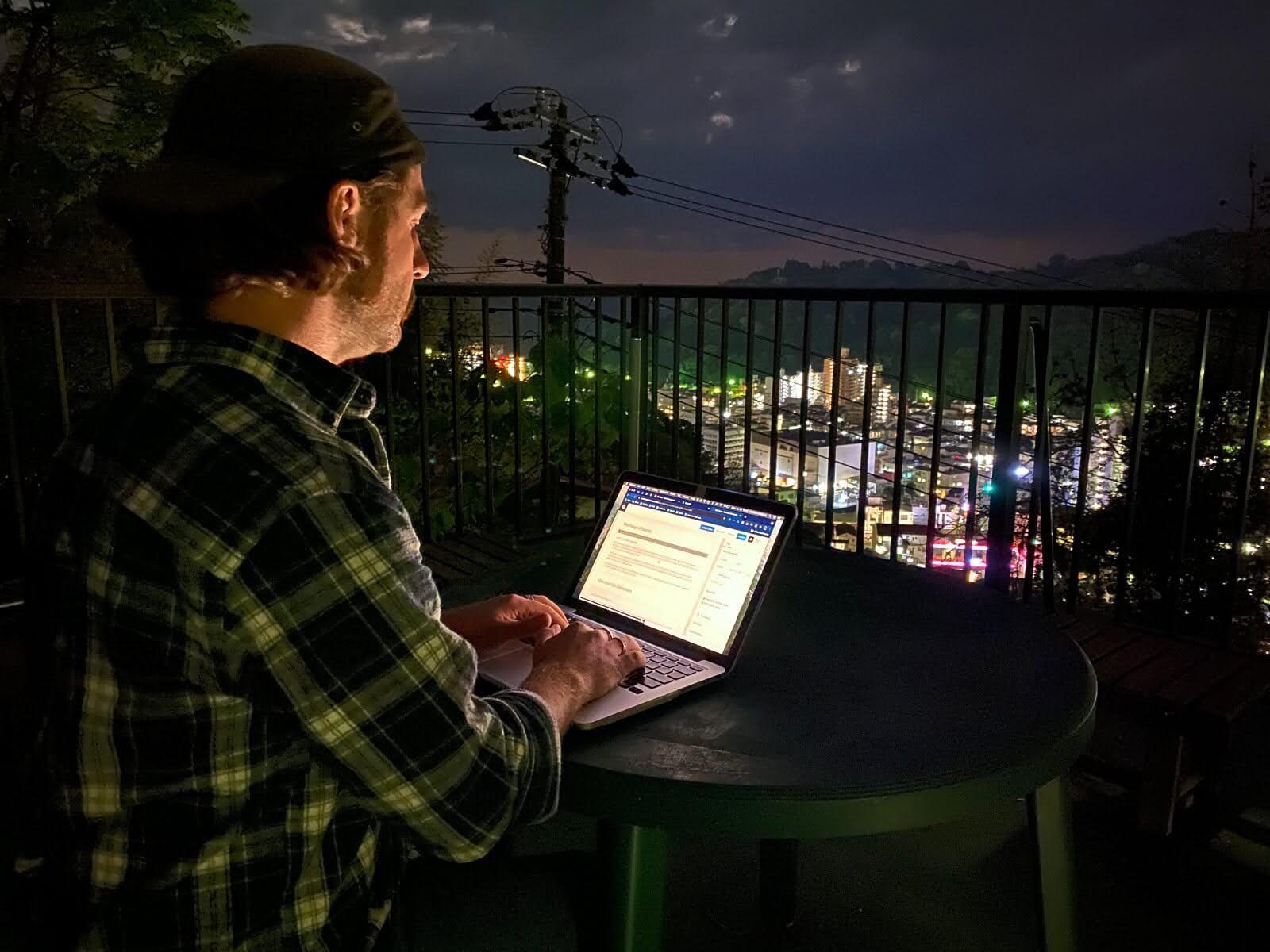 akiyaz-home-services-1-4x3-1600-tiny Matt Ketchum of Akiyaz working on a computer above Yugawara in Kanagawa, Japan.